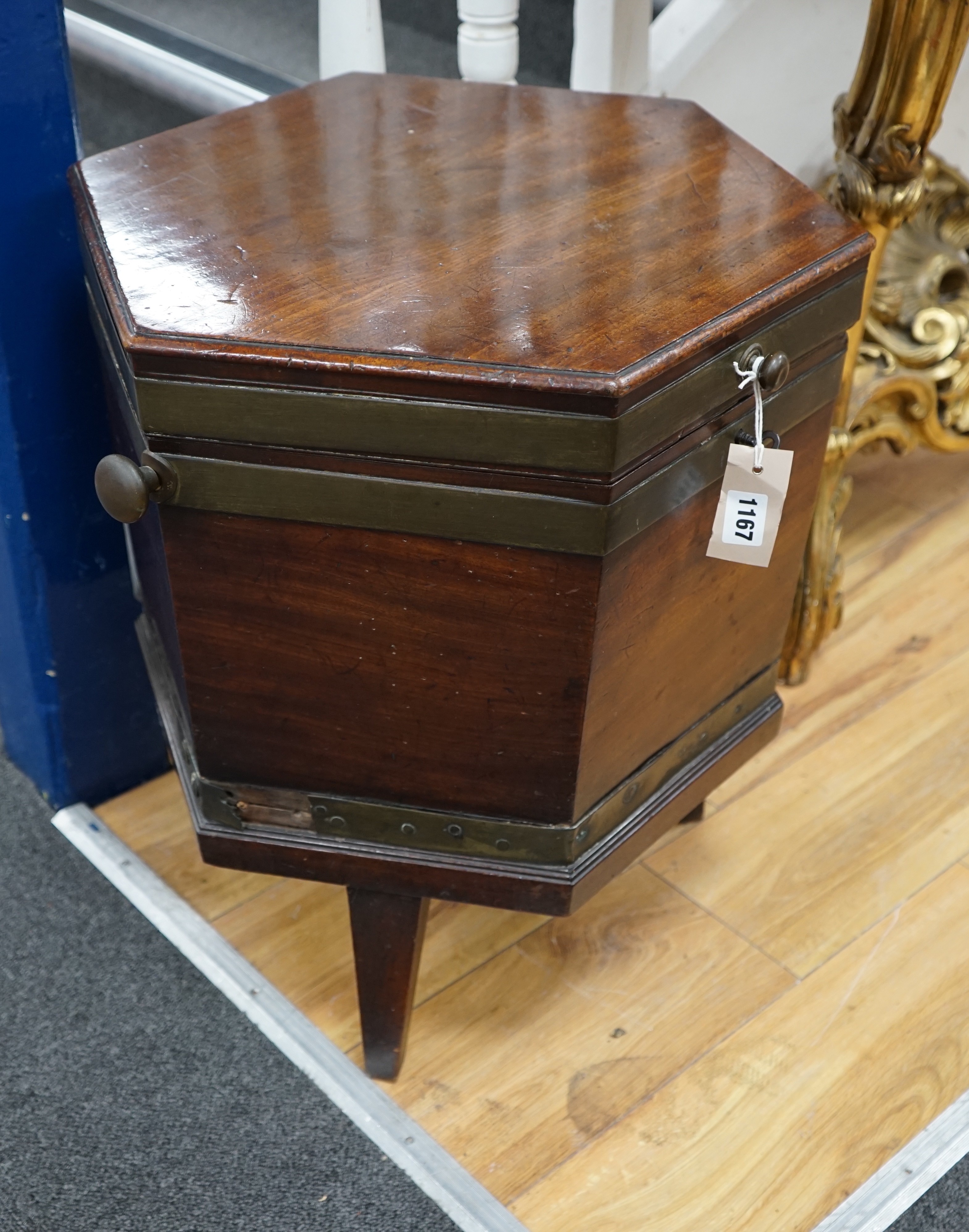 A George III mahogany and brass bound hexagonal cellaret on a reduced stand, width 43cm, height 54cm